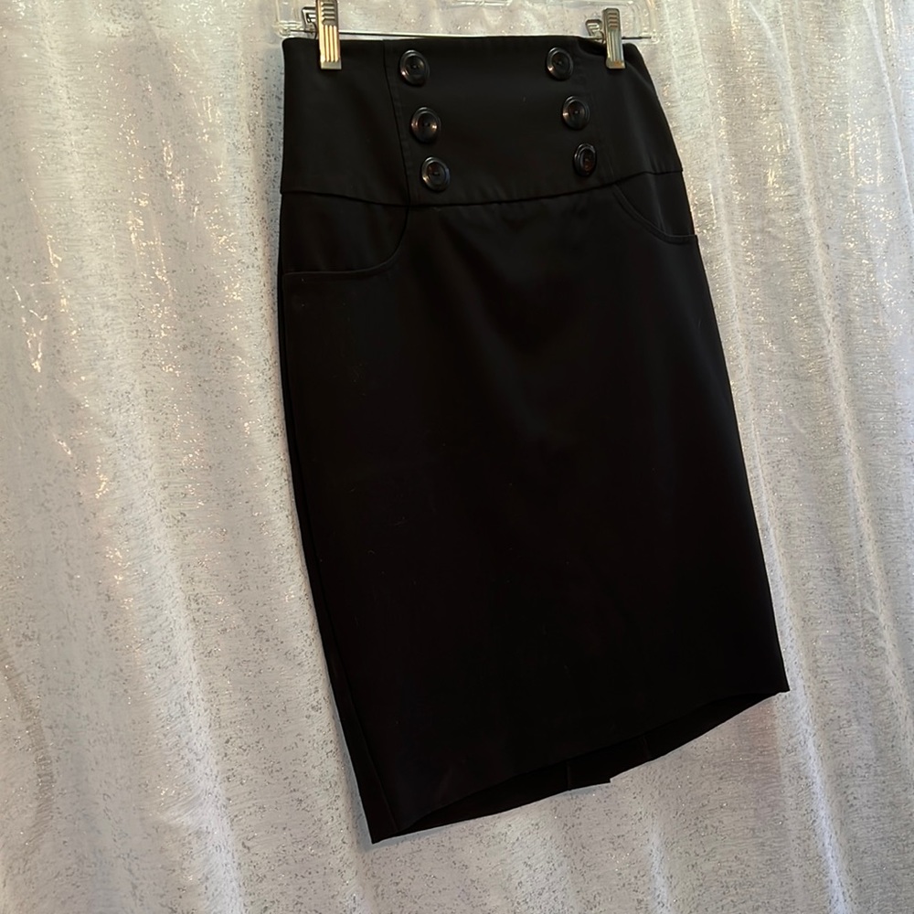 Slightly above the knee black skirt